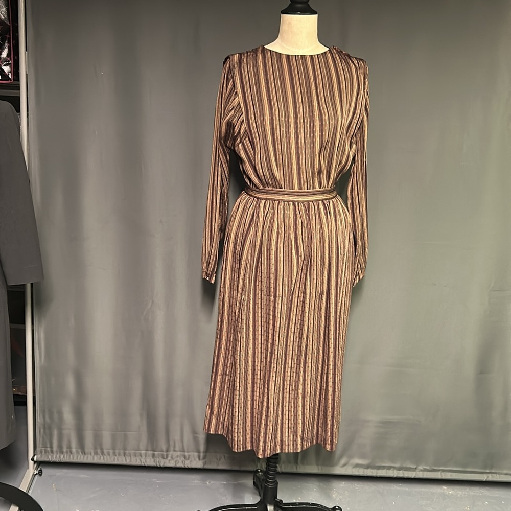 Paula Saker 2 piece outfit in shades of brown and deep plum. Size 6